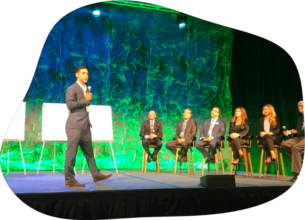 A photo of Eddie Gomez giving a conference.